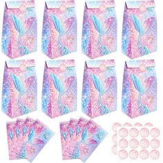 a bunch of pink and blue bags with different designs on them, all lined up together