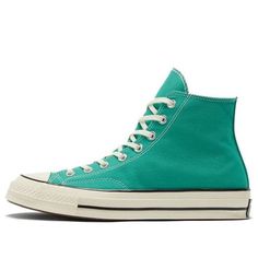 The Converse Chuck 70 High 'Court Green' is a modern take on the classic 1970s design. Featuring a sharp toe and two-tone stitching, the sneaker is a stylish addition to any wardrobe. The rubber sole provides a comfortable fit and the green colorway adds a subtle level of sophistication. Perfect for everyday wear, the Chuck 70 High is inspired by the original 1970s design and is sure to make a statement. Whether you're running errands or out for a night on the town, the Chuck 70 High is the perfect choice. (SNKR/Cozy/Light/Unisex/High Top) Retro Sneakers With Contrast Sole, Retro High-top Sneakers With Contrast Sole, Vintage High-top Sneakers With Contrast Sole, Retro High-top Sneakers For Spring Streetwear, Vintage Mid-top High-top Sneakers With Contrast Sole, Spring High-top Sneakers With Rubber Toe Cap, Green High-top Canvas Shoes With Contrast Sole, Retro Canvas High-top Sneakers With Rubber Toe Cap, Green High-top Sneakers With Rubber Heel Cap