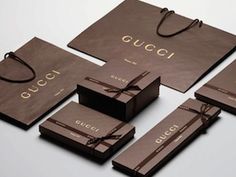 several brown bags with the word gucci on them