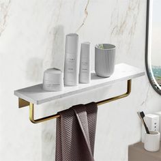 a bathroom shelf with three items on it and a window in the backround