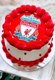 a red and white cake sitting on top of a table