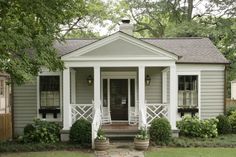 an image of a small house with porches