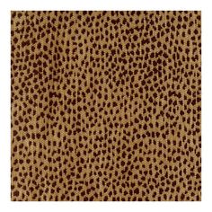 a brown and white background with small dots on the fabric, which is very similar to an animal print