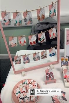 a table topped with lots of cards and magnets next to a wall mounted mirror