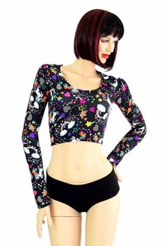 "This item is made to order, please read all the way through the listing before purchasing! UV glow top is a playful unicorn and rainbow print on lycra spandex. This crop top has a scoop neckline and long sleeves, and a four way stretch fit. LENGTH: 8\" (from the underarm to the hemline) Black zen soft knit cheekies are sold separately. Womens Sizing (See below for instructions on where measurements should be taken) XXS: Bust 29\"-30\" / Waist 22\"-23\" / Hips 30\"-32\" Extra Small: Bust 31\"-32 Playful Fitted Tops With Character Print, Fitted Playful Tops With Character Print, Fitted Black Tops With Character Print, Printed Fitted Tops, Printed Fitted Elastane Tops, Printed Stretch Elastane Tops, Fun Multicolor Pride Tops, Playful Black Stretch Top, Black Playful Stretch Top