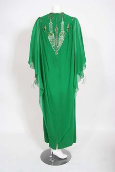 For Sale on 1stDibs - Spectacular 1965 Pierre Cardin haute couture designer silk chiffon gown in the prettiest emerald green color. In 1951 Cardin opened his own couture house Elegant Green Kaftan For Evening, Elegant Green Formal Kaftan, Festive Green Evening Gown, Embellished Green Kaftan For Wedding, Festive Green Evening Kaftan, Green Embellished Kaftan For Evening, Elegant Green Kaftan For Party, Luxury Chic Green Kaftan, Evening Green Embellished Kaftan