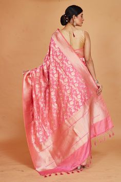 Look your ethnic best on special occasions in this light pink Katan silk Banarasi saree. It is adorned with an overall zari work jaal. The saree comes with a matching blouse piece. Disclaimer: The shown stitched blouse on the model is for display purpose only. The saree comes with a matching blouse piece and finished with fall and piko. Banarasi Sari, Silk Banarasi Saree, Tussar Silk Sarees, Indian Clothing Store, Fashion Journals, Katan Silk, Tussar Silk Saree, Banarasi Saree, Zari Work