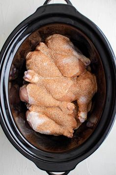 the chicken is being cooked in the slow cooker