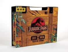 a wooden box with an image of a dinosaur on the front and side, which says jubasc park