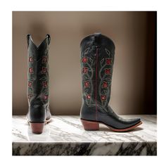 Idyllwind Women's El Camino (Snip Toe) Western Boots Medium Sizes, featuring a rich brown color and intricate floral embroidery with red rose inlay design on the shaft that adds a touch of feminine charm to your Western look. Crafted from high-quality leather, these boots offer a unique and stylish twist on classic Western footwear. The snip toe and pull tabs make these boots easy to slip on and off, while the 15" shaft height provides coverage and support. The Western heel adds height and a tou Traditional Fitted Snip Toe Boots, Traditional Fitted Boots For Rodeo, Black Cowboy Boots With Roses, Rose Embroidered Boots, Western Embroidered Boots For Rodeo, Luxury Red Western Boots, Western Embroidered Mid-calf Boots For Fall, Western Look, Heel Caps