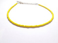 This beautiful bright yellow choker is handmade with medium sized (8/0) seed beads. It comes in multiple sizes, ranging from a choker fit (14 inches), small necklace (18-20 inches), to a longer necklace (24 inches). Each necklace from my shop also comes with additional extender chain, making it easily adjustable. Message with any questions or personalization requests! Yellow Choker, Y2k Choker, Yellow Beaded Necklace, Necklace Y2k, Chain Making, Yellow Necklace, Small Necklace, Bead Choker, Summer Necklace