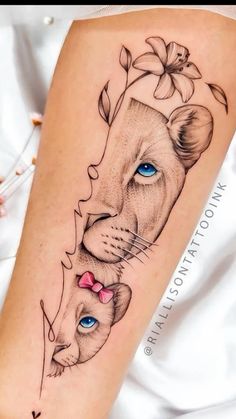 a woman's leg with a tattoo on it and a lion head in the middle