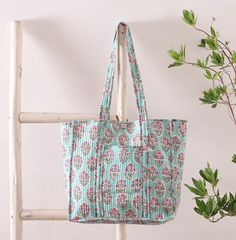 This large cotton tote bag is an everyday essential. Whether its a trip to the shops or a trip to beach these spacious bags will do the job perfectly.  They come in two sizes  LARGE - 38cm x 36cm x 17cm XL - 42cm x 36cm x 20cm They are lovely handmade by skilled artisans. The fabric is printed by hand using handcrafted wooden blocks giving a wonderfully vibrate and original finish. Cotton Beach Bag With Double Handle For Daily Use, Large Capacity Cotton Rectangular Weekender Bag, Green Cotton Canvas Bag With Double Handle, Green Cotton Double Handle Canvas Bag, Large Cotton Shoulder Bag For Travel, Large Capacity Green Cotton Bag, Cotton Gift Bags With Double Handle, Green Large Capacity Cotton Shoulder Bag, Large Capacity Green Cotton Shoulder Bag