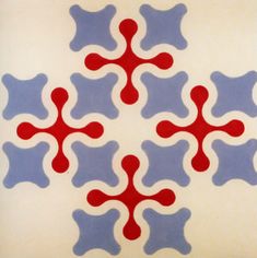 an artistic tile design in red, blue and white