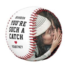 a woman kissing a baseball with the words you're such a catch on it