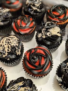 cupcakes decorated with black, red and white icing