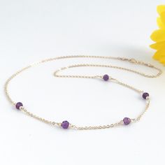 Add subtle sparkle to your outfit with this dainty purple amethyst necklace. This delicate necklace features your choice of either 3 or 5 purple amethyst gemstones on your choice of sterling silver or 14k gold filled chain. Lengths are available from 14 - 20 inches. Amethyst is the February birthstone. Your new necklace will arrive in a gift box. More amethyst jewelry https://www.etsy.com/shop/AustinDowntoEarth?search_query=amethyst More gemstone necklaces https://www.etsy.com/shop/AustinDowntoE Minimalist Amethyst Purple Necklace, Minimalist Purple Gemstone Necklace, Dainty Amethyst Jewelry With Delicate Chain, Dainty Purple Gemstone Necklace, Elegant Amethyst Necklace With Delicate Chain, Elegant Purple Necklace With Delicate Chain, Amethyst Necklace With Delicate Chain For Gift, Delicate Amethyst Chain Necklace As A Gift, Delicate Amethyst Chain Necklace For Gift