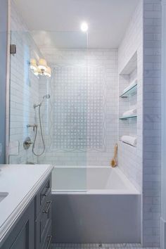 a bathroom with white tile and blue walls