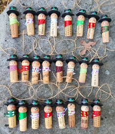 several corks are wrapped in twine and decorated with christmas decorations on top of each other