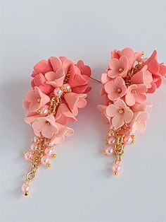 https://purplebeestudio.etsy.com Handmade unique polymer clay chandelier earrings in soft peach colour. These very elegant earrings will become your favorits for many occasions day or night. Perfect gift for a special woman in your life. Earrings made with brass ear wire. The earrings are very light and comfortable to wear all day. SHIPPING: Your order will be dispatched in a securely packed cardboard box. Product care:  - To ensure the product quality and durablility, avoid contact with water, lotion, perfumes and household cleaners and chemicals. - You can clean the products with a slightly damp soft fabric.  - Sharp objects can damage the clay surface. - When not in use, store in a dry, seperate box. Thank you for visiting my shop! If you have any special requests, I'll be happy to do m Pink Polymer Clay Flower Earrings For Weddings, Pink 3d Flower Polymer Clay Earrings, Elegant Pink Polymer Clay Jewelry, Pink Polymer Clay Earrings With 3d Flowers, Pink Polymer Clay Jewelry For Wedding, Pink Polymer Clay Jewelry For Weddings, Gold Earrings For Wedding, Clay Chandelier, Earrings For Wedding