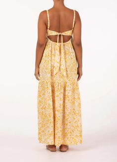 FINAL SALE Light and summery, this effortless maxi dress features a perfectly contoured bodice, statement open back, adjustable ties for the perfect fit and relaxed skirt that falls to a floaty tier. Pair with your favorite sandal to take you from market strolls to sunset aperitifs. Made from European Flax which is naturally sustainable, biodegradable and becomes more beautiful with wear. In Peony's exclusive Daffodil floral print in shades of yellow. Statement open back with adjustable ties for Brunch Maxi Dress With Adjustable Straps, Spring Fitted Maxi Dress With Tie Back, Fitted Tie-back Maxi Dress For Spring, Chic Tie-back Maxi Dress For Daywear, Daywear Maxi Dress With Tie Back, Backless Maxi Dress For Spring Day Out, Maxi Dress With Tie Back For Daywear, Backless Sundress With Tie Back For Casual Wear, Backless Sundress With Tie Back For Dress Down