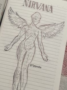 a drawing of a man with wings on top of a notebook page that says nirvana