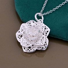 Make your inner beauty bloom. This captivating necklace features a delicate sterling silver Lotus flower with filigree openwork detail. Includes 18 in. chain. Material: 925 sterling silver plated Size: 30mm x 25mm Complimentary gift box. (Regular Price $27.99) Sterling Silver Flower Necklace, Western Dance, Lotus Flower Necklace, Teardrop Diamond, Silver Flower Necklace, Statement Choker, Diamond Jewel, Colorful Wedding, Rose Necklace