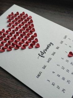 an american flag made out of hearts on top of a calendar