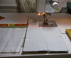 the sewing machine is working on some fabric