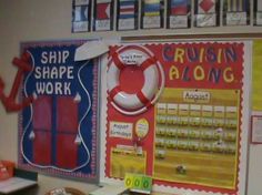 there is a bulletin board on the wall in this classroom with ships and life preservers