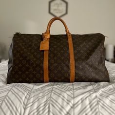 Lv Keepall 60 Travel Duffle/Duffel Bag With Luggage Tag, Lock With Key, And Dust Bag. Overall In Good Condition. No Exposed Piping. No Tears On The Canvas. Zipper Works Just Fine. Watermarks And Other Marks On The Vachetta As Pictured But Can Be Taken To A Cobbler To Even Out. Offers Are Welcome. Designer Brown Travel Bag For Daily Use, Designer Brown Bag For Trips, Rectangular Monogram Canvas Bag With Luggage Sleeve, Designer Brown Travel Bag With Large Capacity, Designer Brown Duffle Bag With Large Capacity, Designer Brown Luggage For Daily Use, Luxury Brown Bag For Overnight Trips, Designer Brown Rectangular Luggage, Rectangular Monogram Canvas Duffle Bag For Everyday