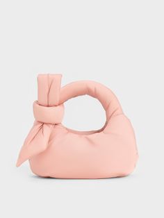 Up the charm factor of your outfits with the Delilah bag. The softness of the puffy texture is accentuated in baby pink, while the bow detail on the handles further enhances the girly appeal of the bag. Its compact size makes it the perfect dainty companion, and with the adjustable strap, you can opt to carry it either by the top handles or as a crossbody bag. Puffy Crossbody Bag, Elegant Pink Bag With Detachable Bow, Chic Pink Shoulder Bag With Bow, Chic Pink Bag With Round Handle, Feminine Pink Bag With Bow, Chic Pink Nylon Bag, Puffy Bag, Chic Crossbody Bag, Girly Bags