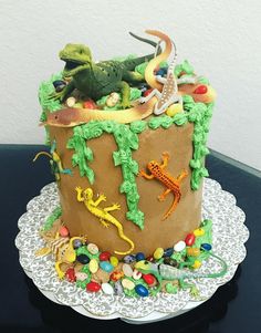 there is a cake that looks like it has animals in the top and on the bottom