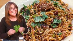 a woman standing next to a plate of food with vegetables on it and a photo of her