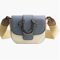 The Horseshoe Mini Bag Is Ready For Your Next Night Out. This Small-Sized Bag Features A Faux Leather Construction And Snap Closure. Finished With A Metallic Blue Horseshoe Detail And Adjustable Shoulder Strap. Measurements: 6.5"W 5.5"H 3"'D Material Shell: 100% Polypropylene Lining: 100% Polyester. 14-26" Strap Drop Front Flap Closure Adjustable Crossbody Strap Interior Slip Pocket Leather Blue Leather Satchel With Metal Hardware, Blue Crossbody Bag With Metal Hardware, Blue Shoulder Bag With Metal Hardware, Trendy Shoulder Bag With Branded Hardware For Errands, Chic Blue Bags With Metal Hardware, Blue Faux Leather Shoulder Bag, Trendy Blue Shoulder Bag With Metal Hardware, Trendy Blue Faux Leather Bag, Trendy Blue Leather Shoulder Bag