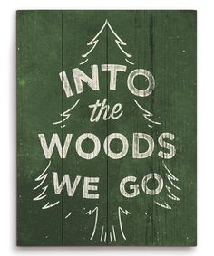 a wooden sign that says into the woods we go, on top of a green background