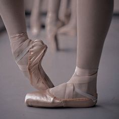 a close up of a person's ballet shoes