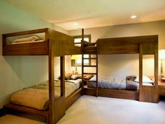 a bedroom with bunk beds and two lamps