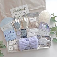 the contents of a baby gift basket are laid out