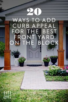 a front yard with flowers and potted plants