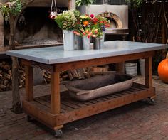 a table with flowers on it in front of an oven