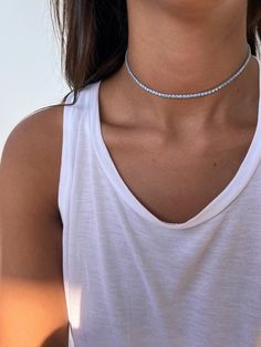 "Sterling silver 925 tennis choker necklace set with light blue cubic zirconia stones, making a simple but elegant statement. The perfect layering piece or minimalist necklace. This necklace is perfect to wear as everyday jewelry and combined layered with other necklaces. Hypoallergenic, lightweight and minimalist. ► FEATURES: * Sterling silver tennis choker necklace 2.5mm. ► MEASUREMENT : Chain length: 11.8\" / 30 cm In addition you will receive an extender chain of 7 cm \\ 2.7\" for you to enj Minimalist Silver Cubic Zirconia Tennis Necklace, Dainty Sterling Silver Tennis Necklace In Silver, Dainty Silver Sterling Silver Tennis Necklace, Silver Cubic Zirconia Tennis Choker Necklace, Tennis Choker Necklace, Choker Silver, Evil Eye Necklace Gold, Constellation Necklace, Choker Necklace Set