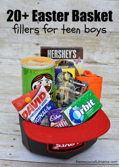 a bucket filled with snacks and candy sitting on top of a wooden table