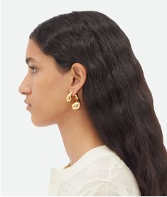 "Find BOTTEGA VENETA Drop Earrings on Editorialist. 18k gold-finish sterling silver earrings. Custom-made push pin closure. External dimensions: 30 x 30 mm | 1.18\" x 1.18\". Thickness: 15 mm | 0.59\". Color: Yellow Gold. Due to hygiene-related reasons, this piece may not be returned. 925/1000 Silver." Gold Shop, Shape Crafts, Eyewear Womens, Push Pin, Bottega Veneta, Wallets For Women, Sterling Silver Earrings, Silver Color, Women's Earrings