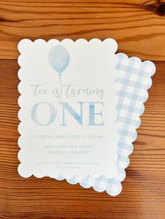 a blue and white gingham themed birthday party with an air balloon on it