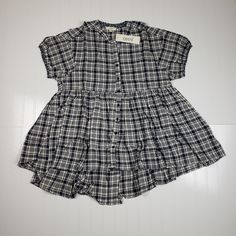 Brand New With Tags Oddy Brand Blouse Top, As Sold In Boutiques. Dark Navy Blue And White Plaid Material. Empire Waist Cut For A Babydoll Like Shape. Bubble Short Sleeves And Buttons Up The Front. Longer Tunic Length And Oversized Fit. Size Large. Measures About 22 In Across Pit To Pit And 29 In Overall Length. In Brand New Condition And Only Taken Out Of Packaging To Measure And Photograph! No Flaws! Casual Spring Blouse With Button Back, Navy Short Sleeve Blouse For Summer, Navy Cotton Top With Placket, Casual Navy Button-up Blouse, Casual Navy Blouse With Buttons, Casual Navy Top With Placket, Casual Navy Short Sleeve Blouse, Plaid Buttoned Tops For Summer, Navy Button-up Summer Blouse