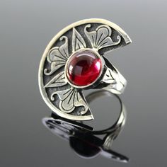 Sterling Silver Corundum Round Ring - Armenian Symbol Ring, Red Gemstone Ring, Autor's Design Ring, Statement Silver Ring, Armenian SilverThe ornament is copied from ancient Armenian national drawings.Author's handwork.Ring size - 4*3 cm.Ring weight - 13 g. Artisan Red Jewelry With Artistic Design, Adjustable Vintage Ruby Ring, Vintage Adjustable Red Ruby Ring, Unique Red Jewelry With Artistic Design, Artisan Red Gemstone Jewelry, Red Artistic Design Jewelry For Gift, Unique Red Ruby Open Ring, Bohemian Ruby Ring For Gift, Handmade Bohemian Ruby Jewelry