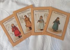 four vintage sewing patterns for children's dresses