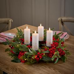 PRICES MAY VARY. TRADITIONAL ADVENT CANDLE SET: Add a cozy, festive touch to your Christmas countdown with this set of four TruGlow Advent candles, crafted from real ivory wax with elegant gold numbering and flickering LED flames. ELEGANT CANDLE HOLDER AND RED BERRY WREATH: This set includes a custom candle holder with four raised trays for perfect candle placement, complemented by a 50cm red berry wreath featuring faux pine foliage, lush green leaves, and seasonal red berries for a classic holiday look. REALISTIC LED FLAMES FOR A SAFE GLOW: Each candle is topped with a warm white, flickering LED flame that stays cool to the touch, creating a cosy ambiance safely throughout the holiday season. CONVENIENT REMOTE AND TIMER FUNCTION: Insert 2 x AA batteries in each candle, use the included re Advent Table Wreath, Traditional Advent Wreath, Christmas Wreath With Candles, Christmas Wreaths Candles, Christmas Wreaths With Candles, Red Advent Wreath, Red Christmas Candle, Wreath Advent, Christmas Advent Wreath