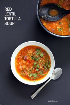 a bowl of red lentil tortilla soup with a spoon next to it